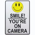 アメリカン雑貨 看板 プラスチックサインボード Smile! You're On Camera CA-51